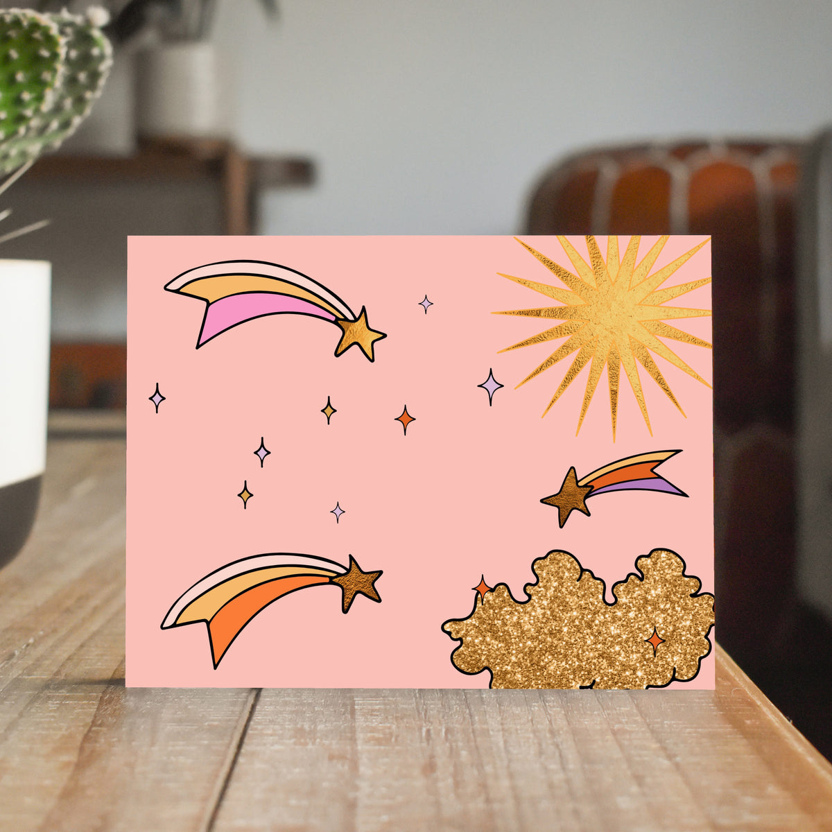 Abstract rainbow and star notecard set with gold-colored outlined graphics on colorful card stock.