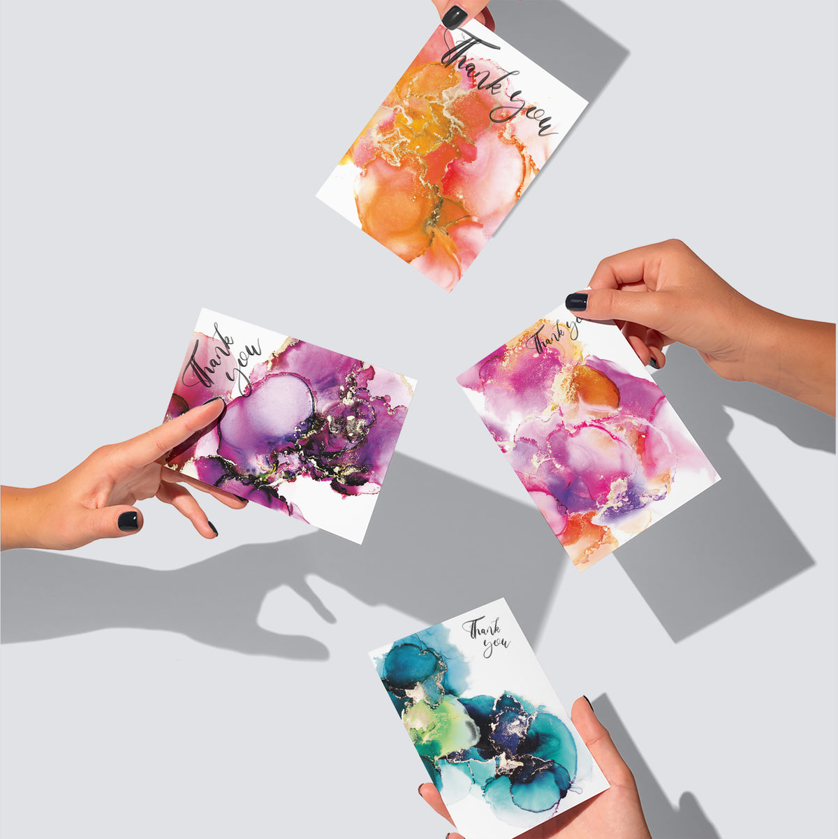 Set of 24 cards in four designs, six cards per design, with fluid alcohol-ink-style patterning throughout.