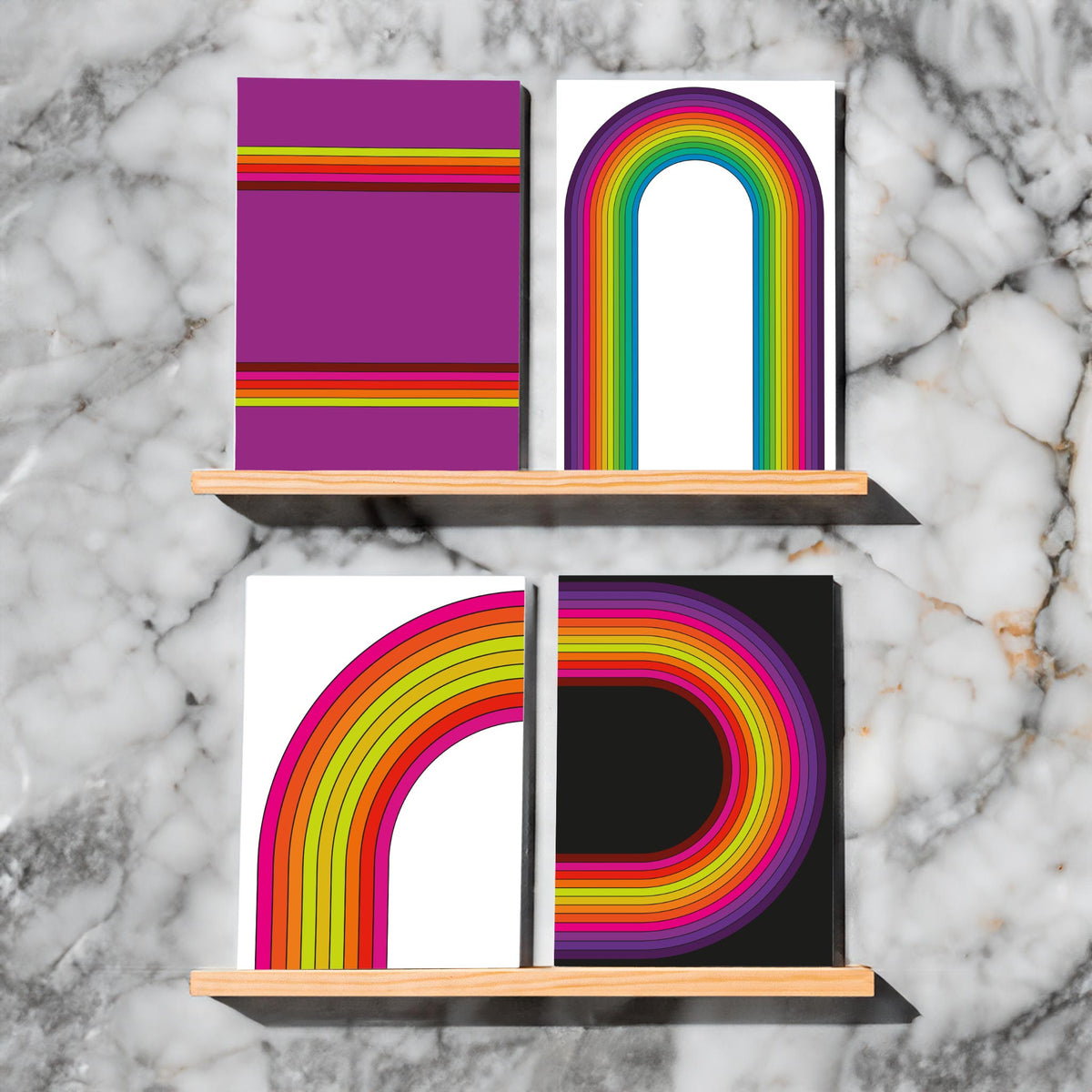 Four retro rainbow card designs: corner arcs, a centered arch, and horizontal stripes on varied backgrounds.