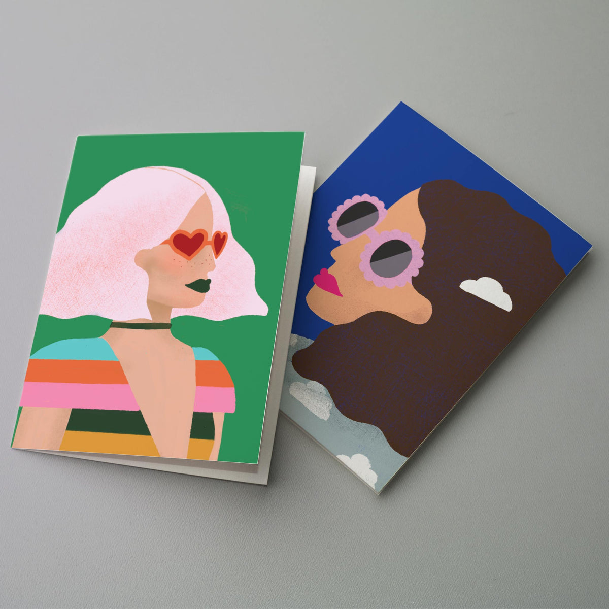 Set of 24 cards with four repeating designs, each a bust-length portrait illustration on a solid color field.