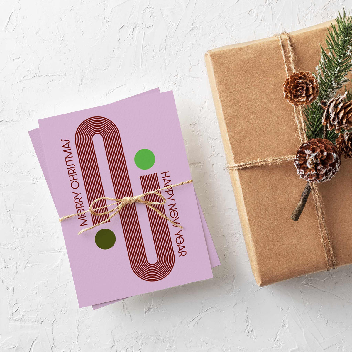 Christmas card set of 24 featuring stacked half-circle bowls, hairpin loops, S-curves, and capsule shapes in holiday colors.