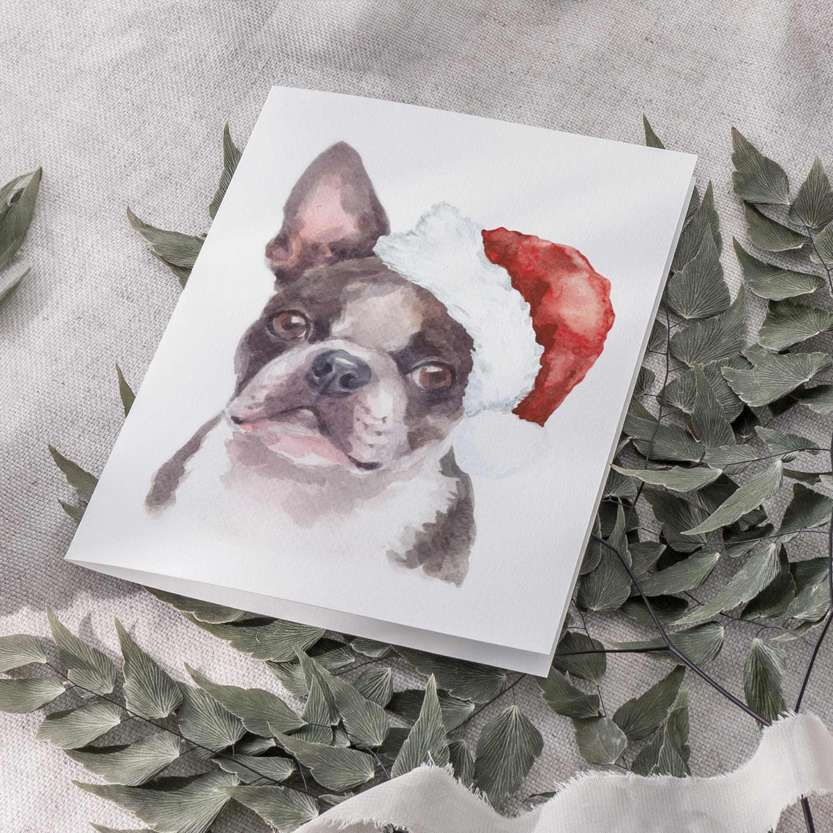 One-design set of 24 cards, watercolor Boston Terrier with dark coat and tipped red cone hat.