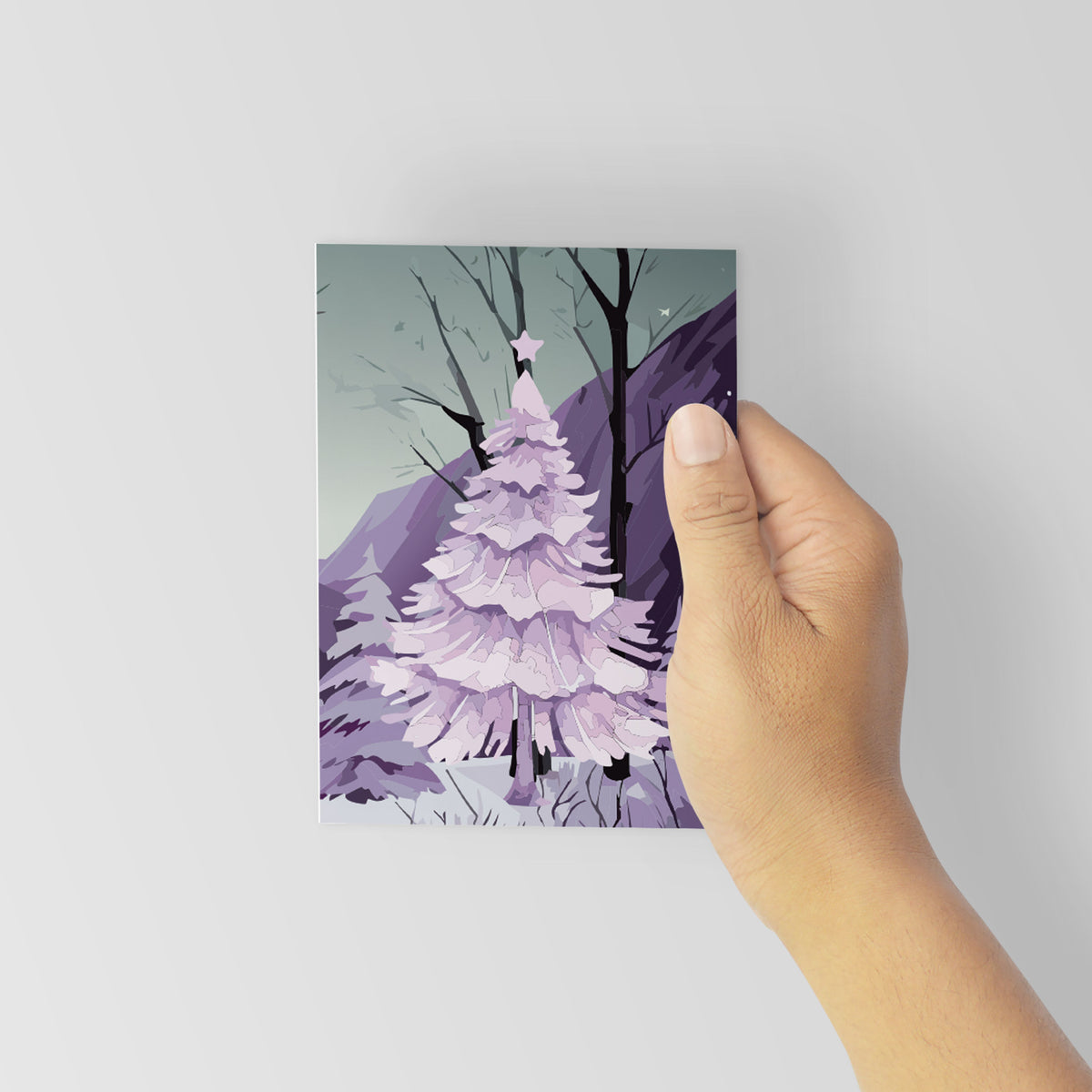 Christmas cards in 12 designs featuring a dominant pale pink, lavender, or gray-white tree in each scene.