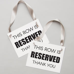 This row is reserved chair sign for wedding